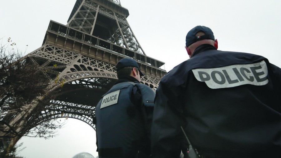 French police patrol near the Eiffel Tower in Paris as part of the highest level of Vigipirate security plan after a shooting at the Paris offices of Charlie Hebdo