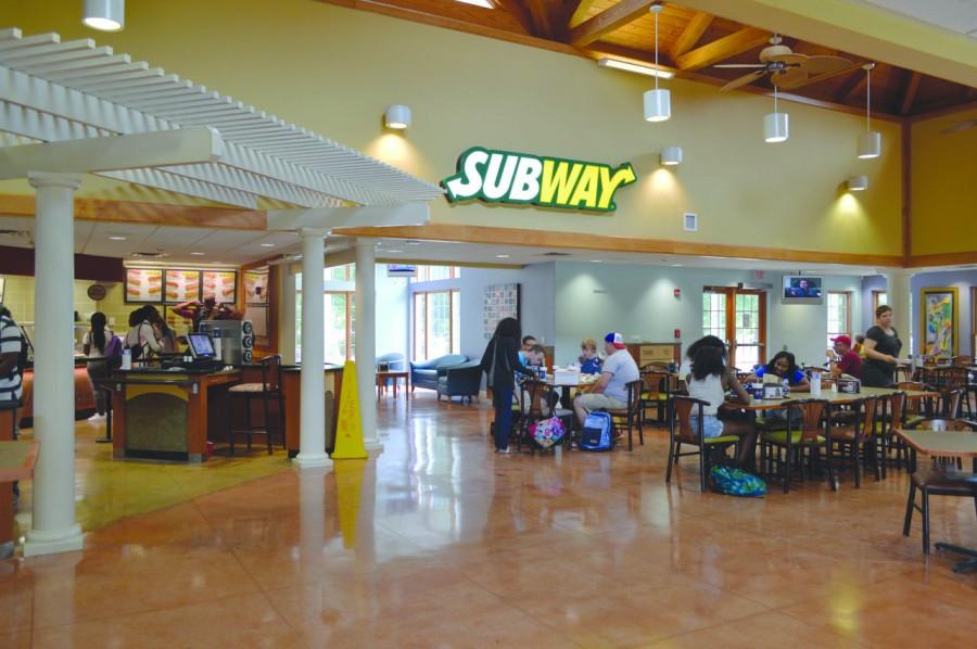 Students and faculty eat lunch at The Grille, trying out the Subway addition on its opening day.