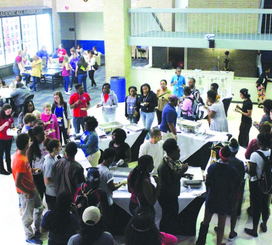 Members from various organizations serve students a taste of different cultures on Oct. 15.