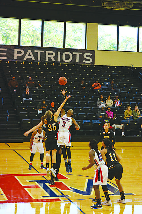 Sophomore Briana Burgins (3) jumps for the ball during the tip off in the game against the P effer Falcons.