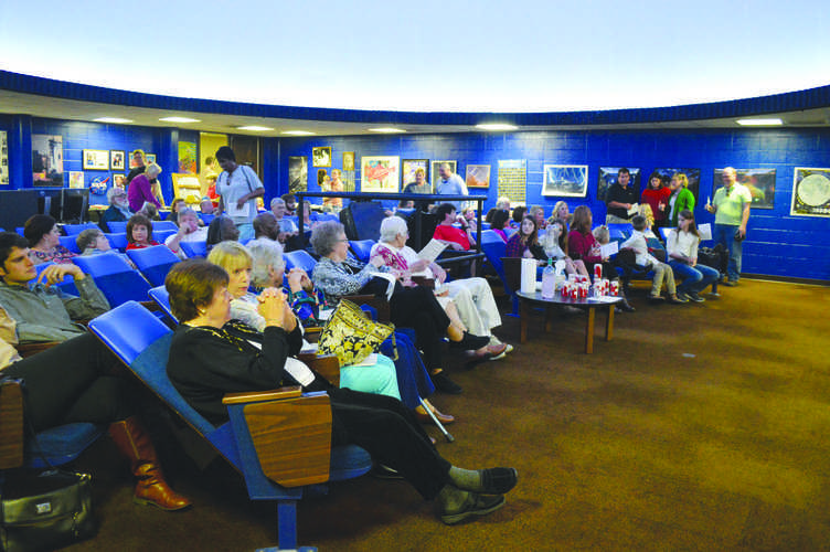 Guests at the Dooley Planetarium wait to hear about the
astronomical possibilities the Christmas Star could have been.