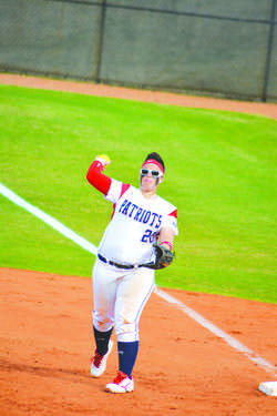 Center infielder Shannan Lopez throws the ball in an attempt to
prevent Brevard College’s Tornadoes form scoring in the doubleheader
on March 3.