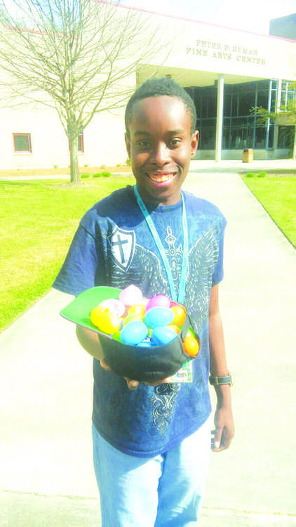 Business management major Julian Wilson collected eggs in his
hat at this year’s Easter egg hunt on the FMU quad.
