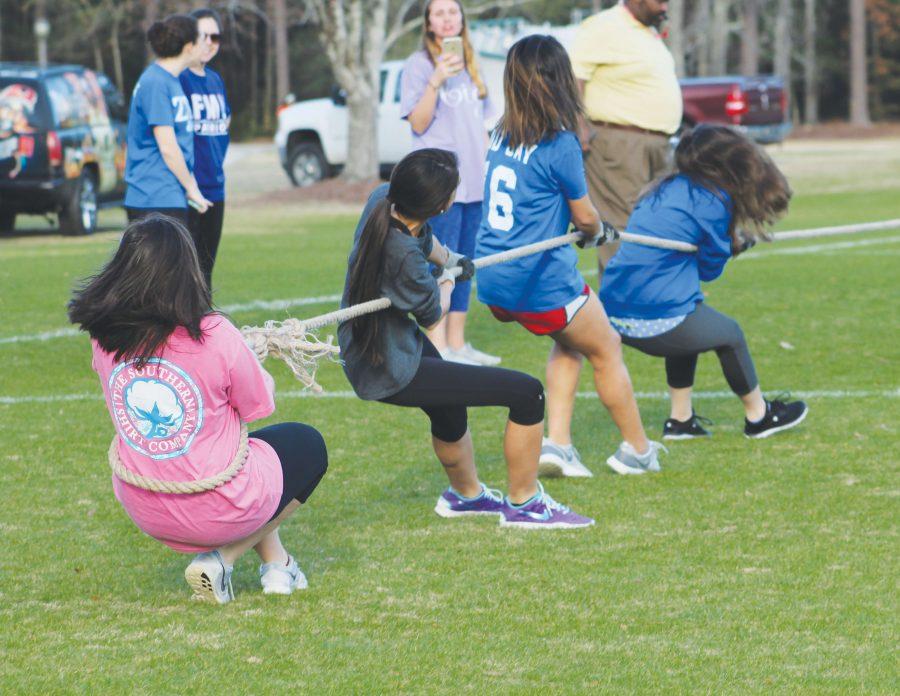 Members of intramural teams compete for points and athletic gear during the Patriot Games. Activities included a water balloon toss, a sack race and a scavenger hunt. 