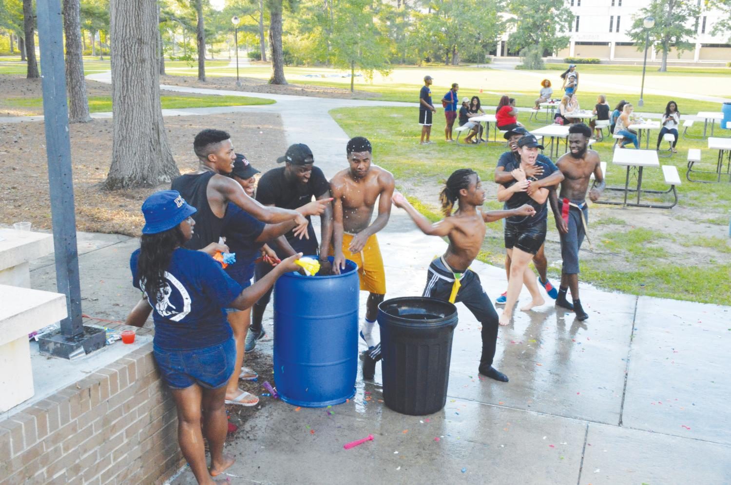 FMU students play capture the flag in the Water Play Field Day.
