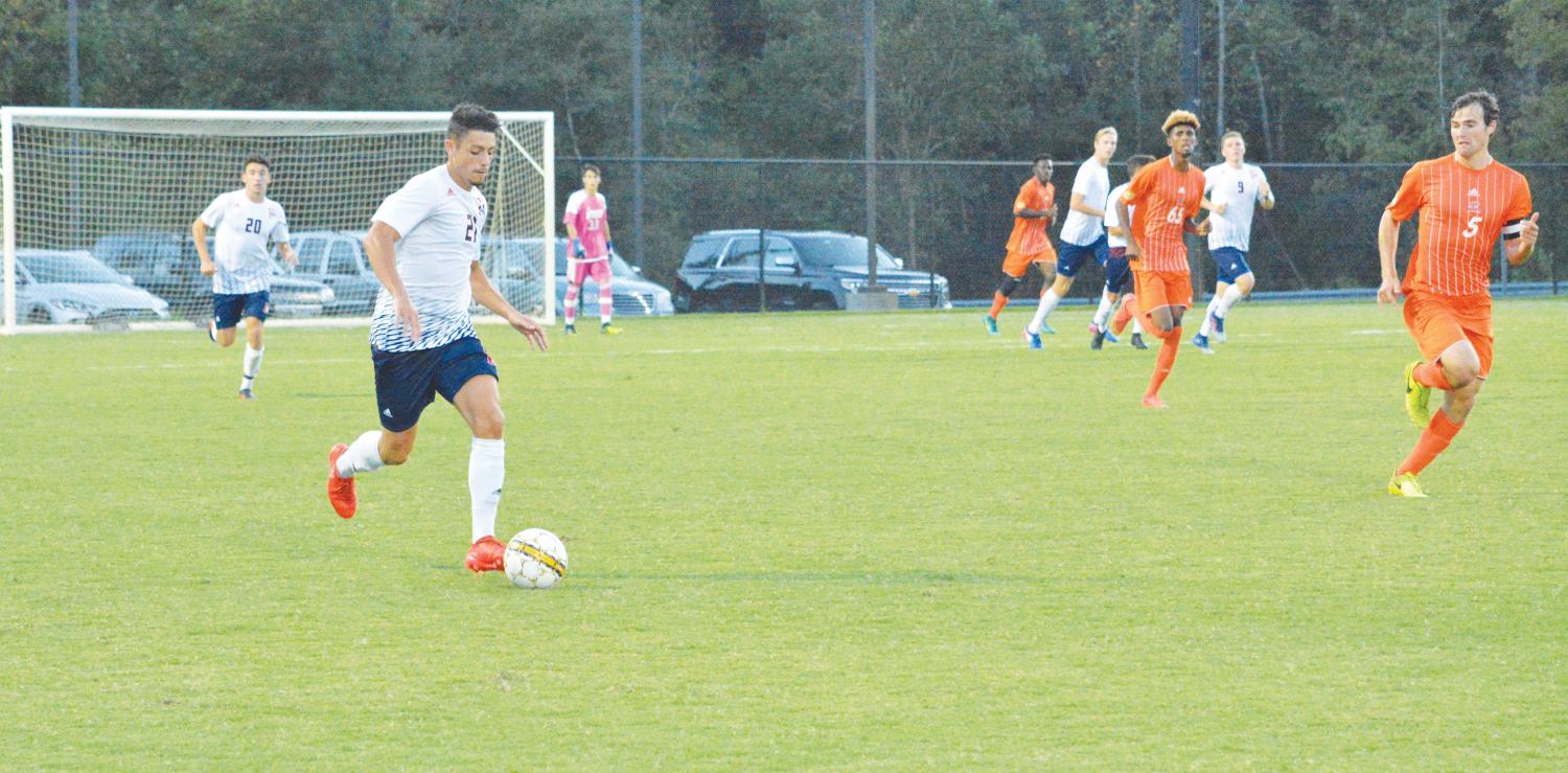 Sophomore Damien Tergella drives the ball down the field during the Sept. 30 match against the Clayton State Lakers. This match marks the first home PBC game of the season.