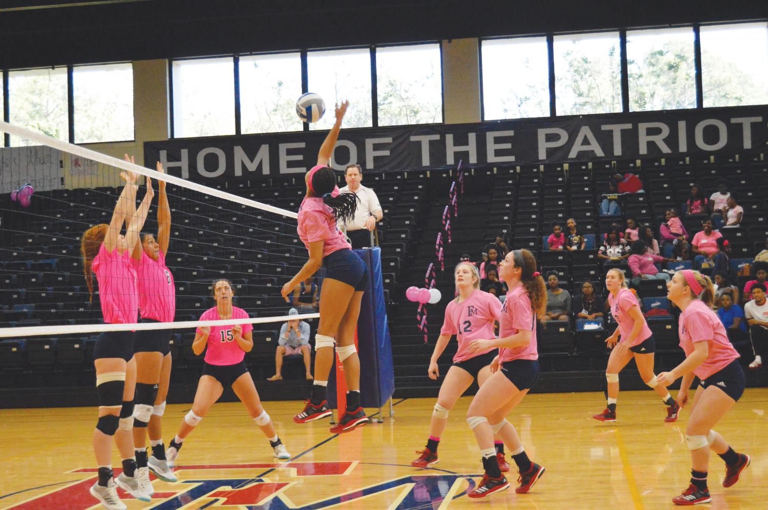Cortney Bowen spikes the ball against the Augusta University Jaguars. Bowen is a first-year player at FMU.