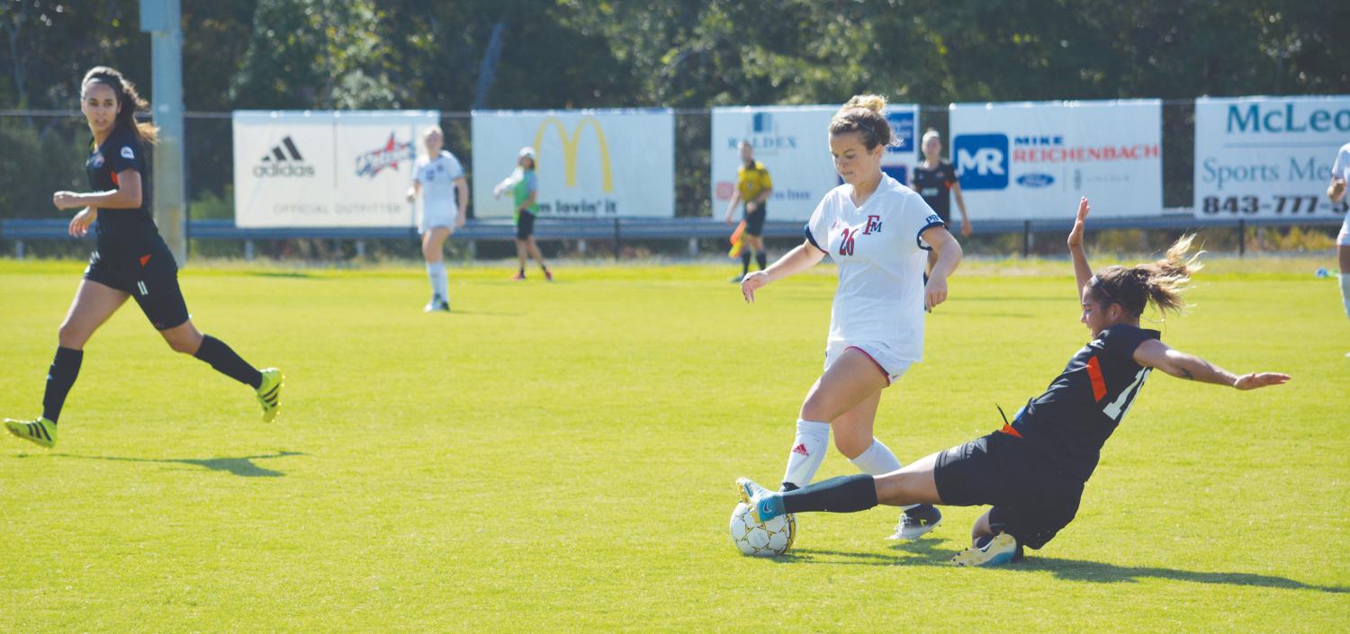 Holly Bowman, freshman mid-fielder, maneuvers around the Lakers’ defense. The match against Clayton State brings the Patriots to a 3-4-0 record.