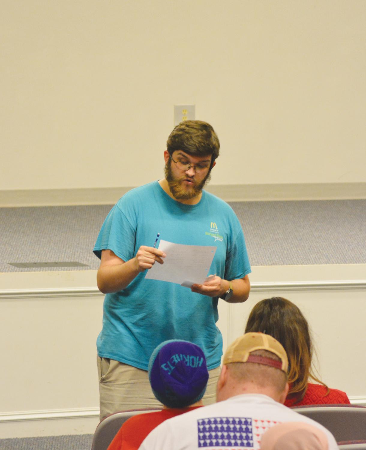 Students share original poetry during the