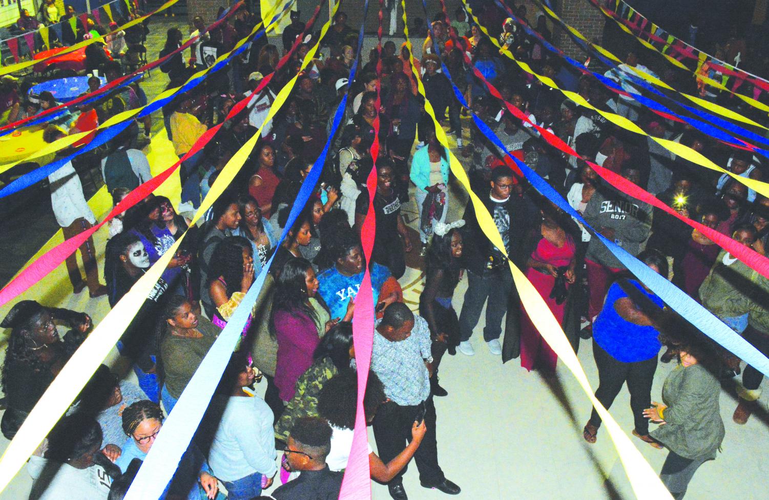 During the 2017 CarnEvil, students gather for the daytime and evening events to play games and dance.