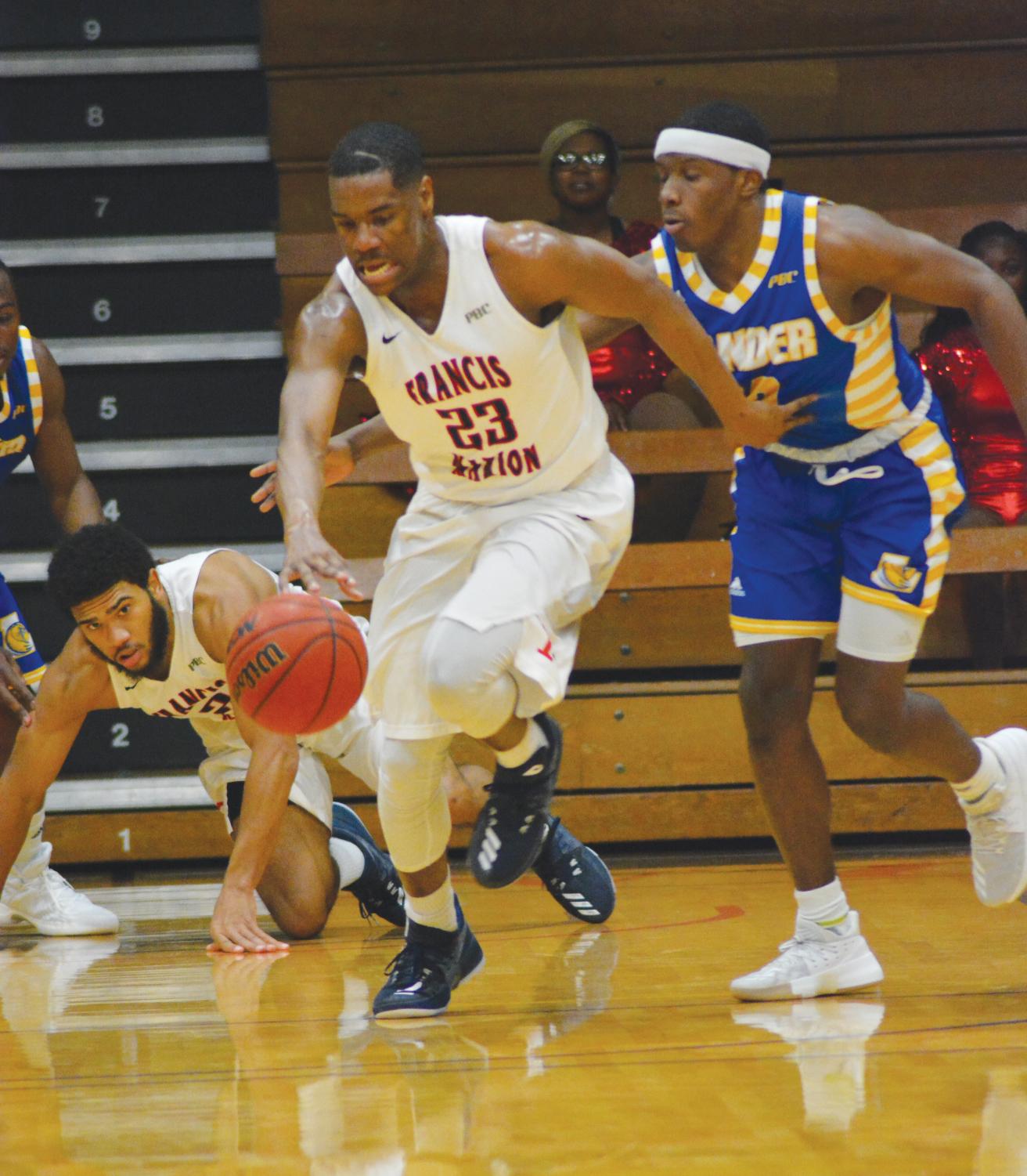 Junior Brandon Parker dribbles the ball down the park during the Jan. 10 game against the Lander Bearcats.