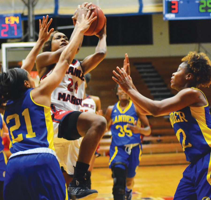 Junior Shaunice Fulmore (24)  lays up the ball against the Lander Bearcats. During this game, Fulmore scored 15 points.