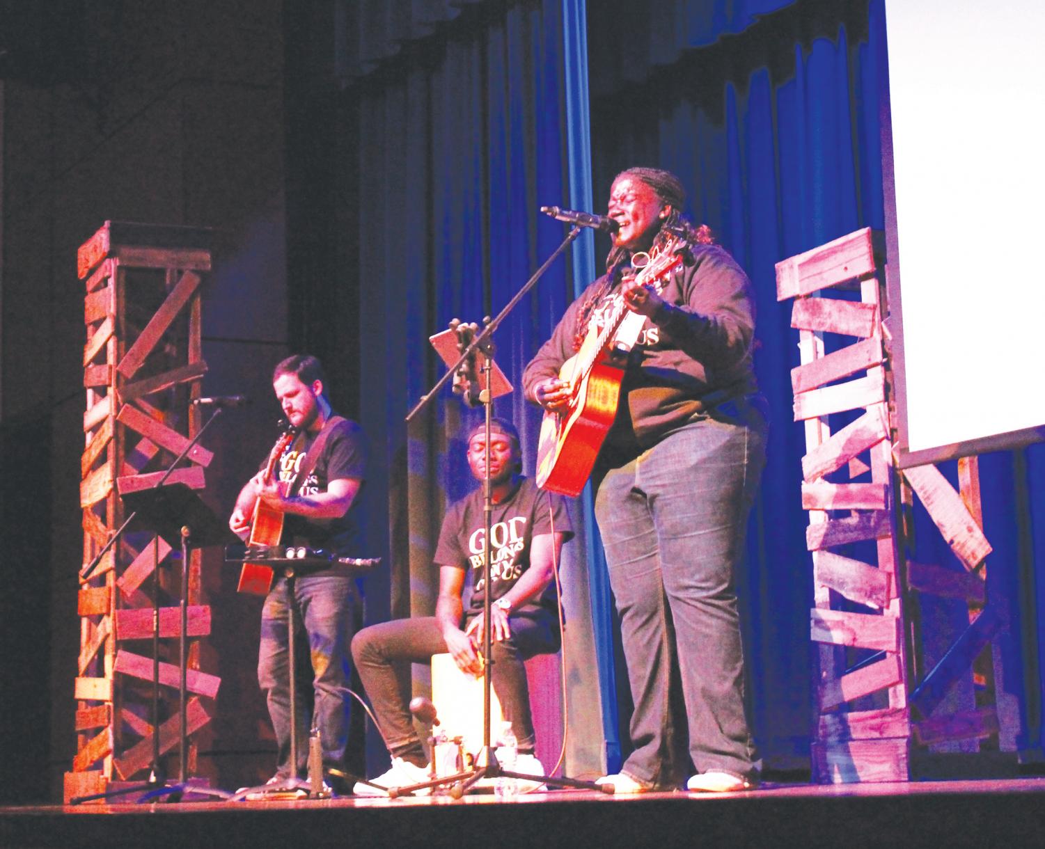 FMU alumni Monet Heyward and Stephen Crowley and senior Rischard Brown play music during God Belongs On My Campus.