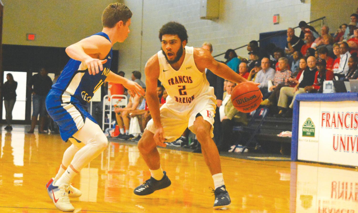 Detrek Browning dribbles the ball down the court during the Feb. 10 game against University of North Georgia.