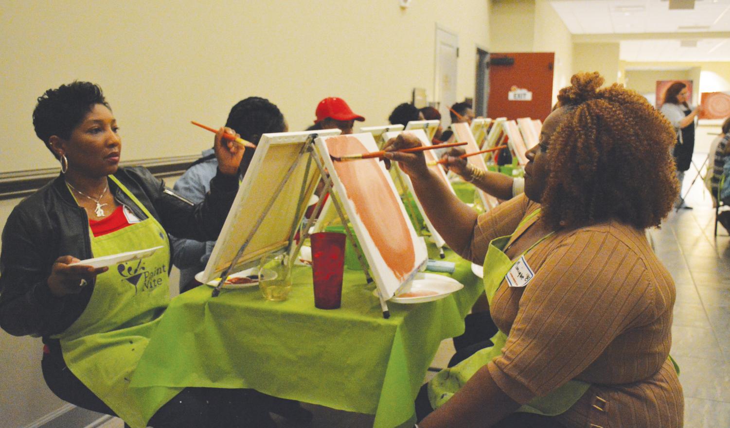 MU almuni paint and socialize at Local Motive Brewing Co. as a part of the Homecoming festivities.