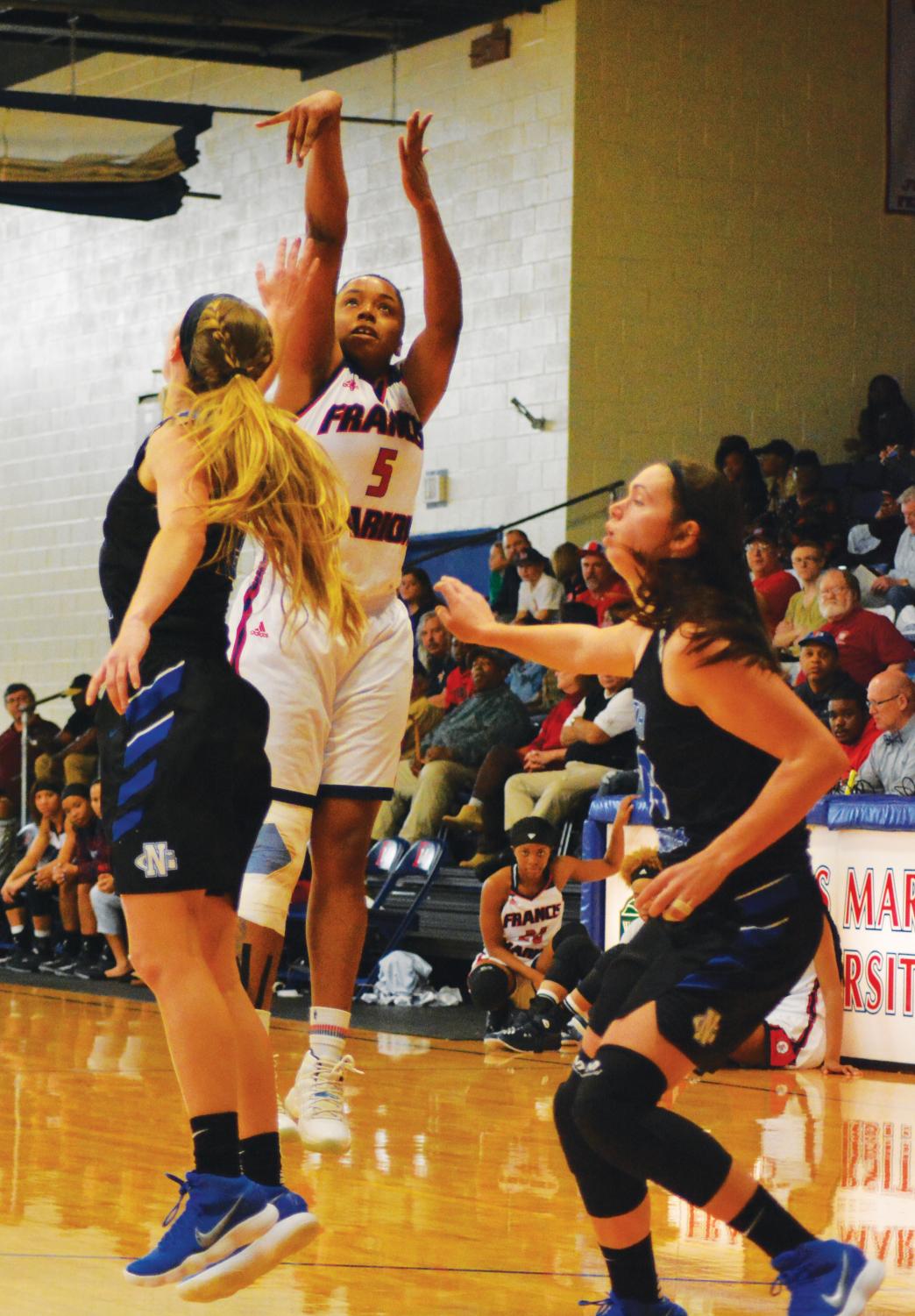 Keauna Williams, junior, shoots and scores against the lady Nighthawks from University of North Georgia.