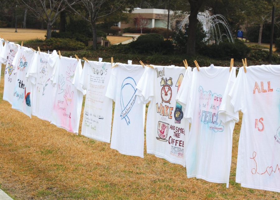 Students+design+T-shirts+for+%E2%80%9CThe+Clothesline+Project%E2%80%9D+display+on+the+Founders+Hall+lawn+during+G-Week.