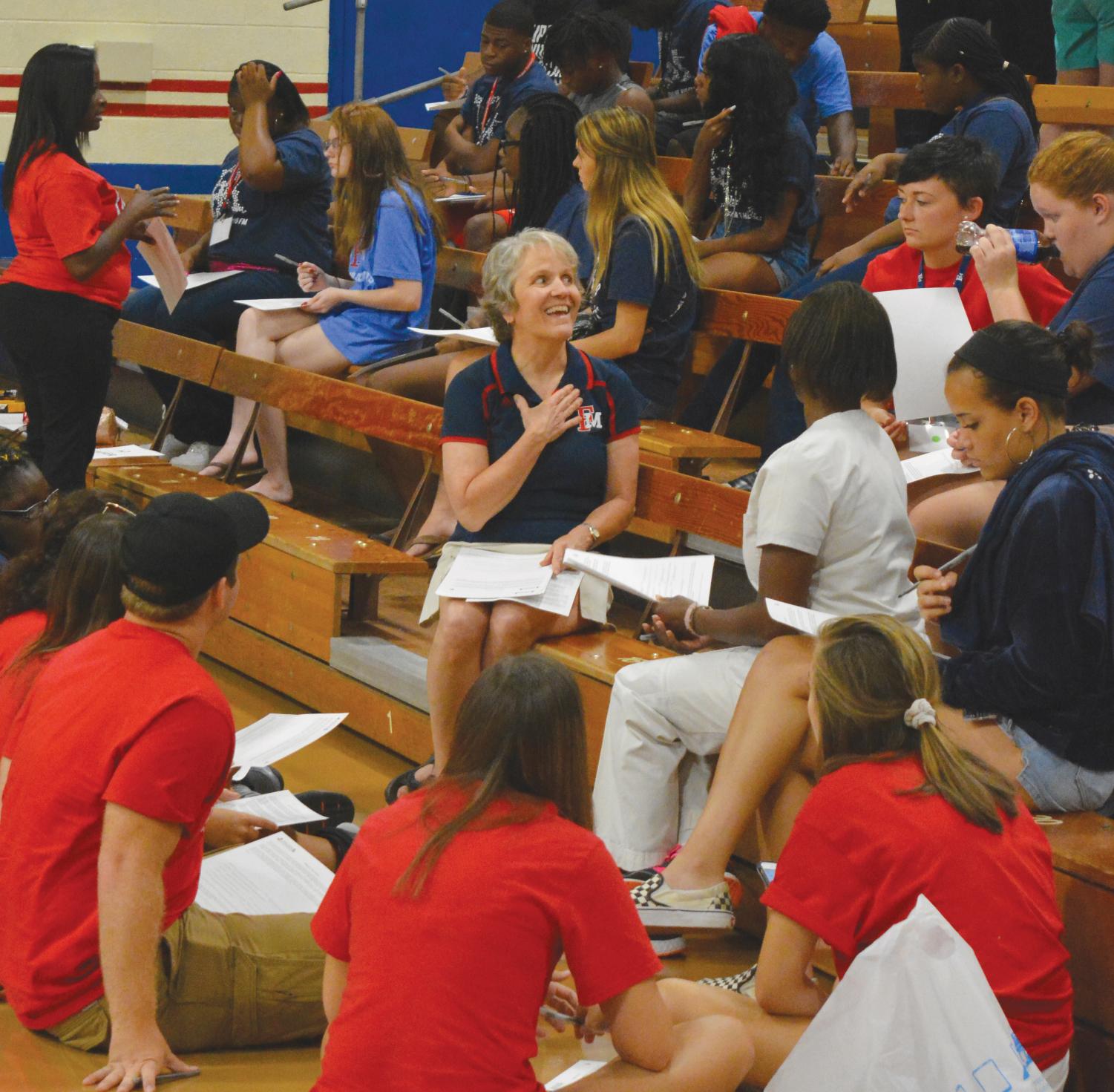 Students broke out into small groups to learn more about each other by completing an activity about their life before college.