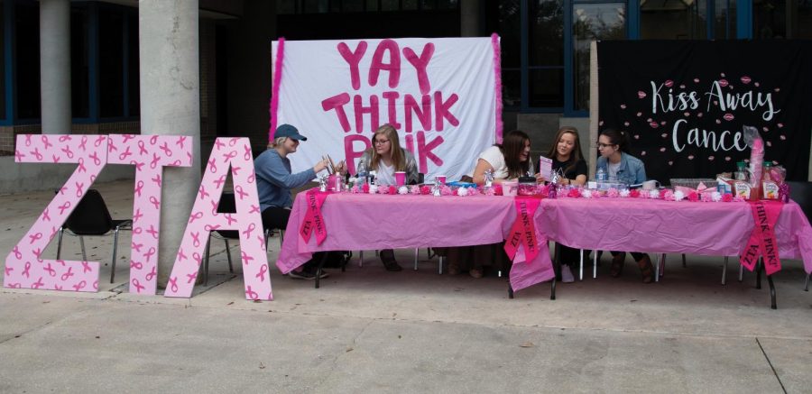 Sisters prepare for the “Think Pink” bake sale.