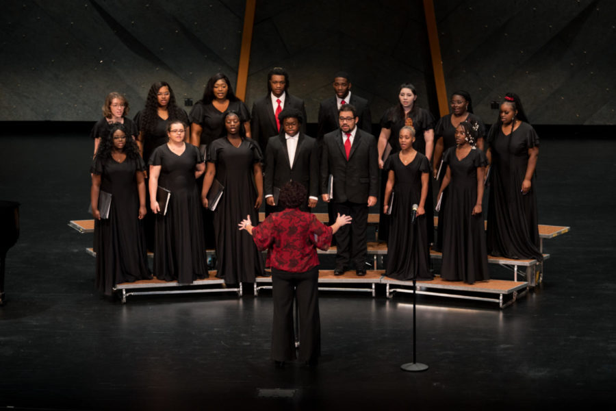 The FMU concert choir looks to their director, Fran Coleman, for direction during their musical performance.
