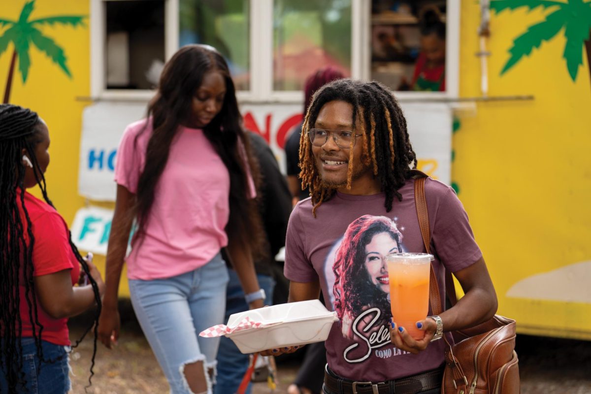 Student gets meal from food truck during activities fair