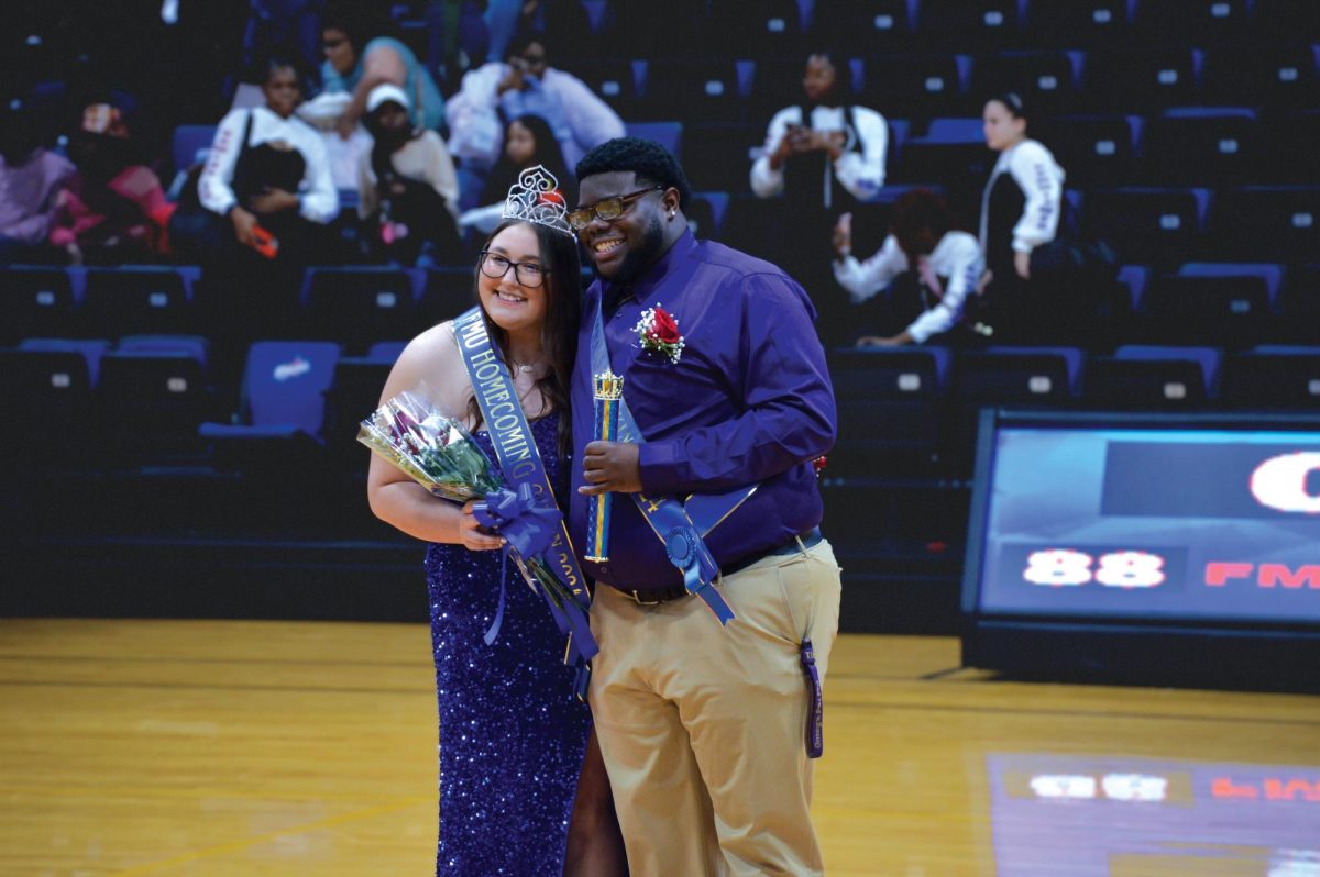 The Homecoming court, Jay Miller and Laney Pope, accept their new titles.