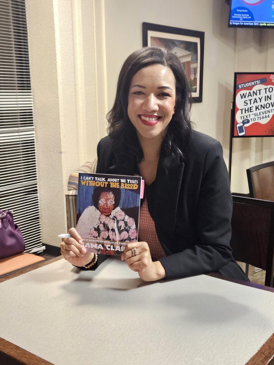 Tiana Clark signs her book for attendees.