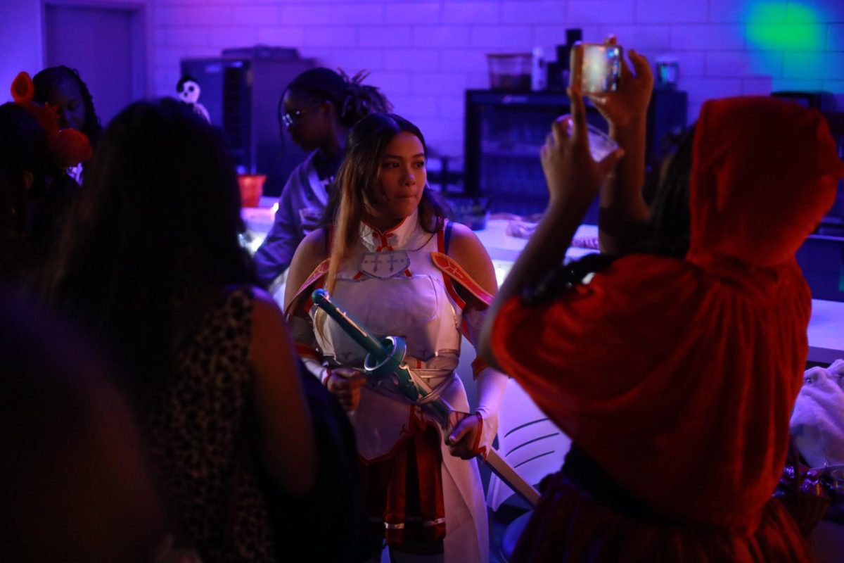 An Asuna cosplayer from the anime Sword Art Online looks beyond the crowd (Oct. 30, 2025).
