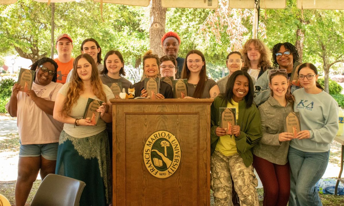 Contributors and members of the publication team hold copies of the latest edition of Francis Marion University’s student-led literary magazine, Snow Island Review, Volume 35 (April 20, 2026).